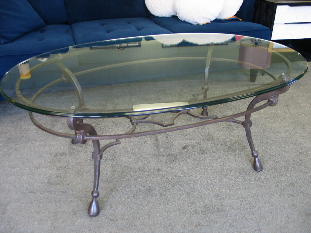 Iron and Glass Oval Coffee Table; 54